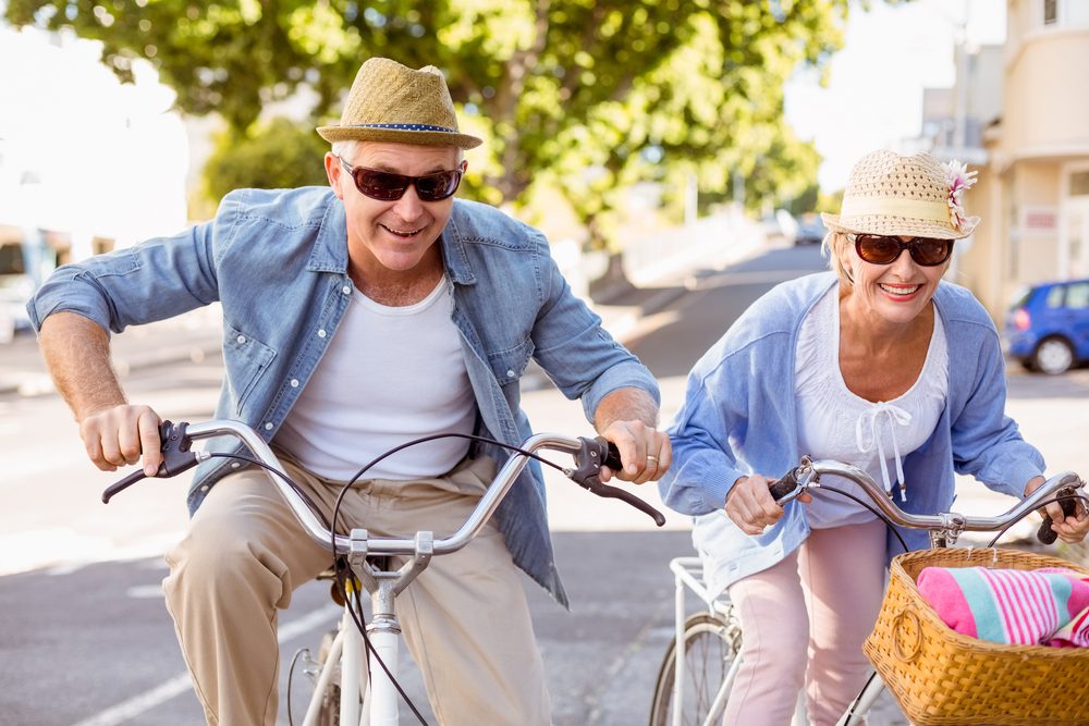 9 Things to do While in the Twin Cities 1 Happy mature couple going for a bike ride in the city on a sunny day